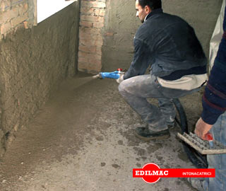 spraying of plaster in a bottom wall with P 90 plastering machine 